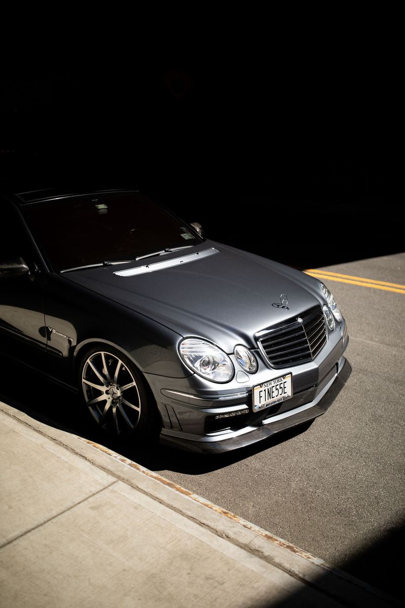 Automotive photography: modified Mercedes-Benz E55 AMG in hard afternoon light