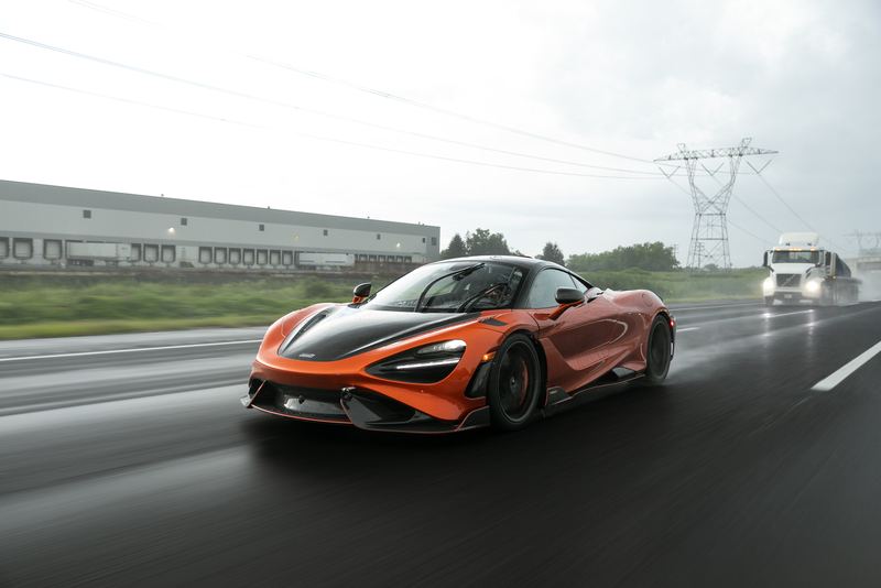 Orange McLaren 765LT rolling through the rain