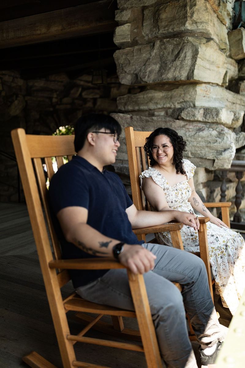 Couple relaxing in porch rocking chairs